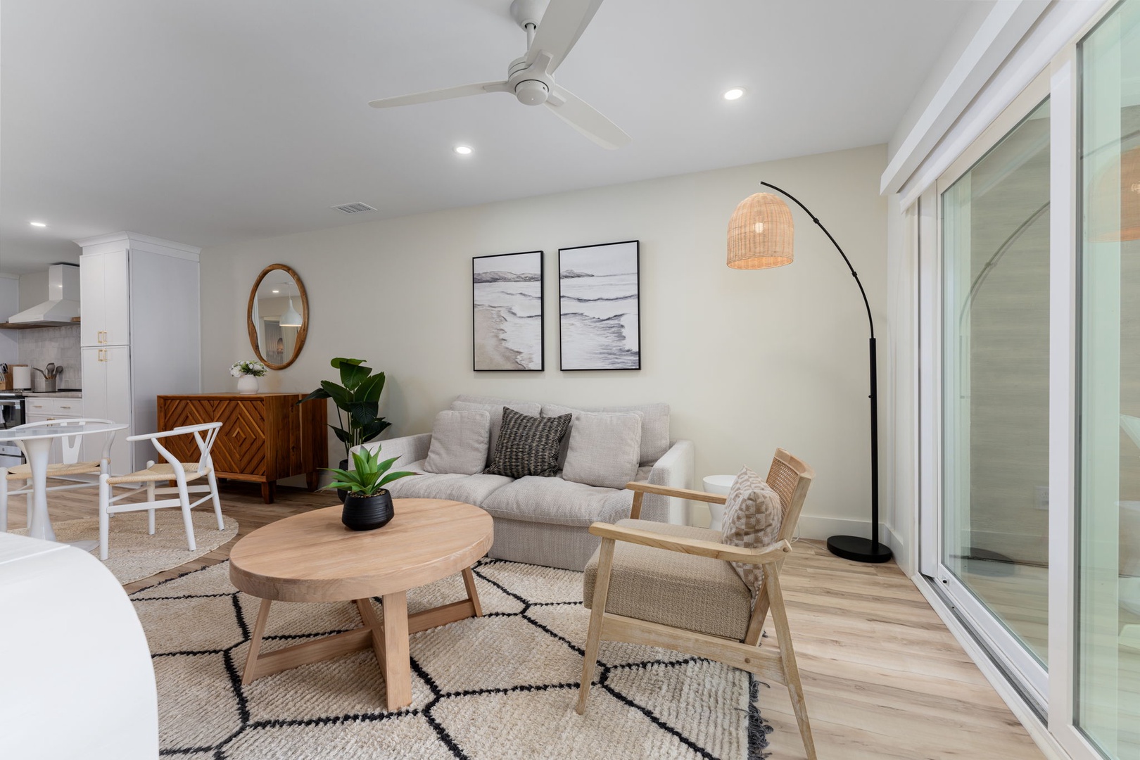 Unwind in your bright open living space with plush seating, modern furnishings, and calming coastal artwork that creates the perfect retreat.
