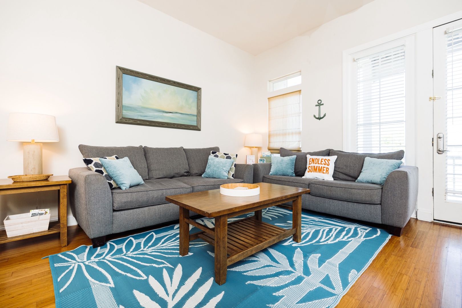 Sink into the plush sectional sofa and unwind in your coastal-themed living space, complete with nautical touches and ocean-inspired décor.