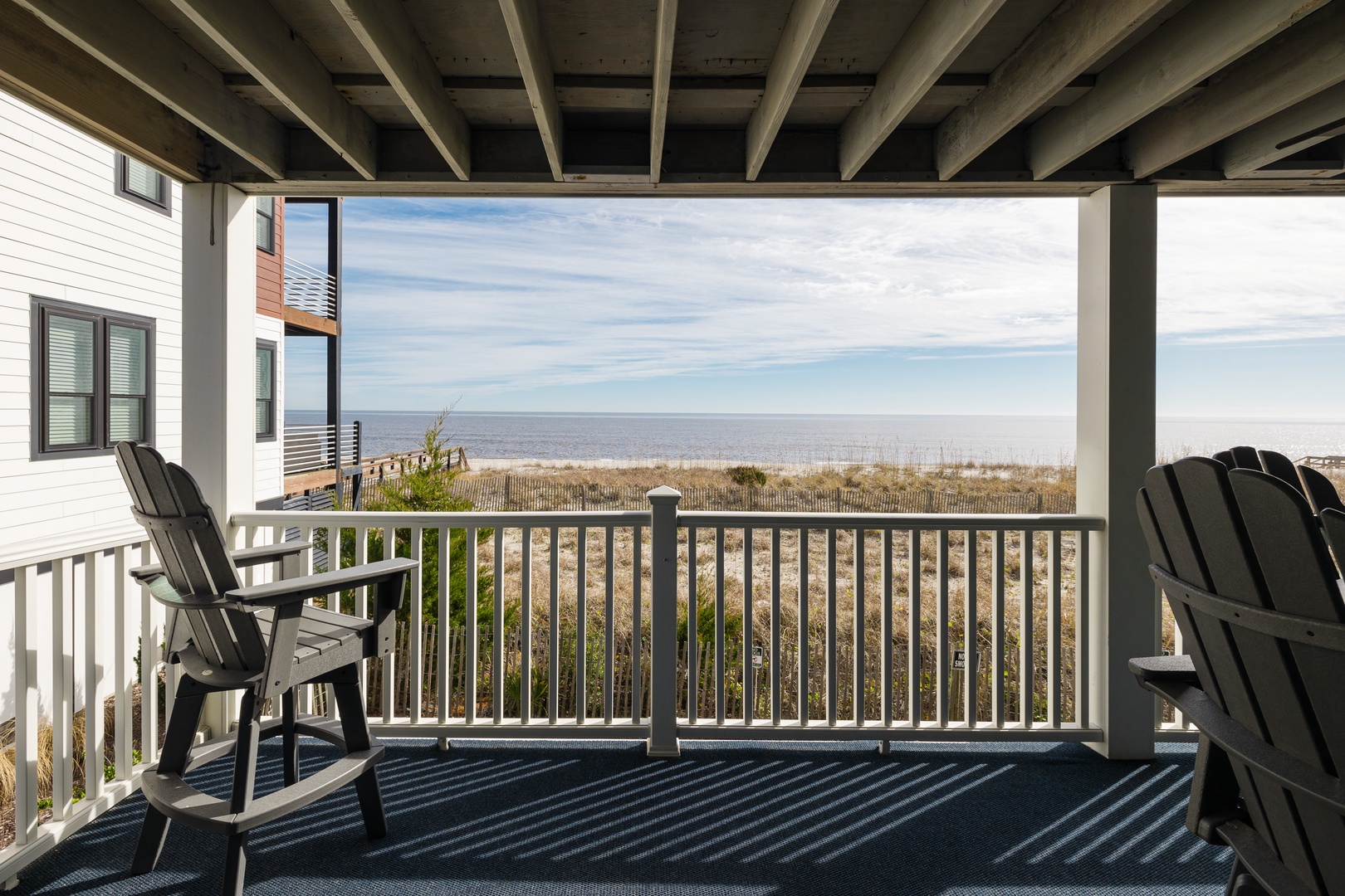 Savor morning coffee on your private balcony as ocean waves and endless horizons create the perfect coastal escape.