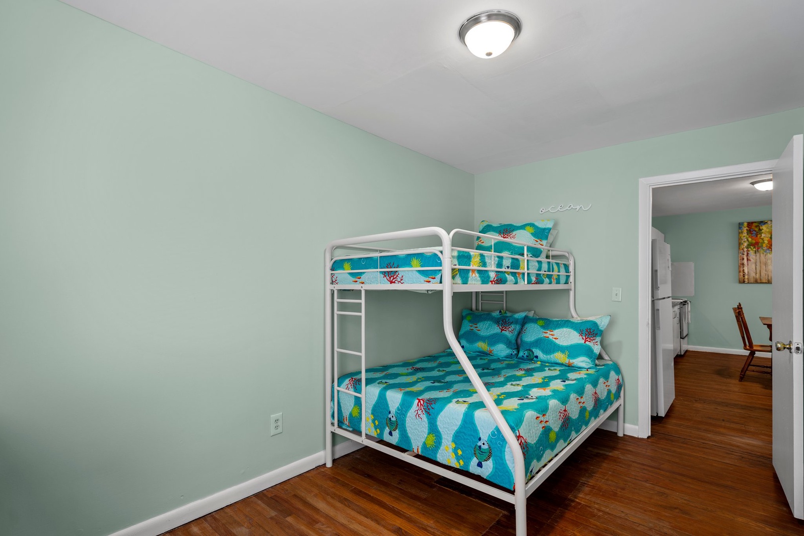 Your kids will love this fun bunk bed room with ocean-themed bedding and plenty of space to play and rest together.