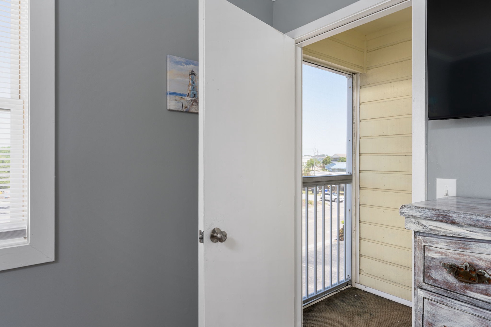 Step onto your private balcony and take in the coastal views from your cozy retreat. This bright, airy bedroom with weathered-wood accents brings coastal charm to your getaway.