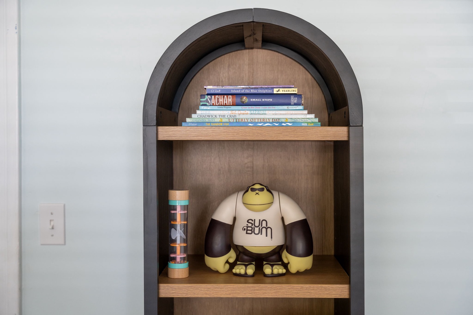 Discover your personal reading nook with curated books and charming décor in this thoughtfully designed alcove.