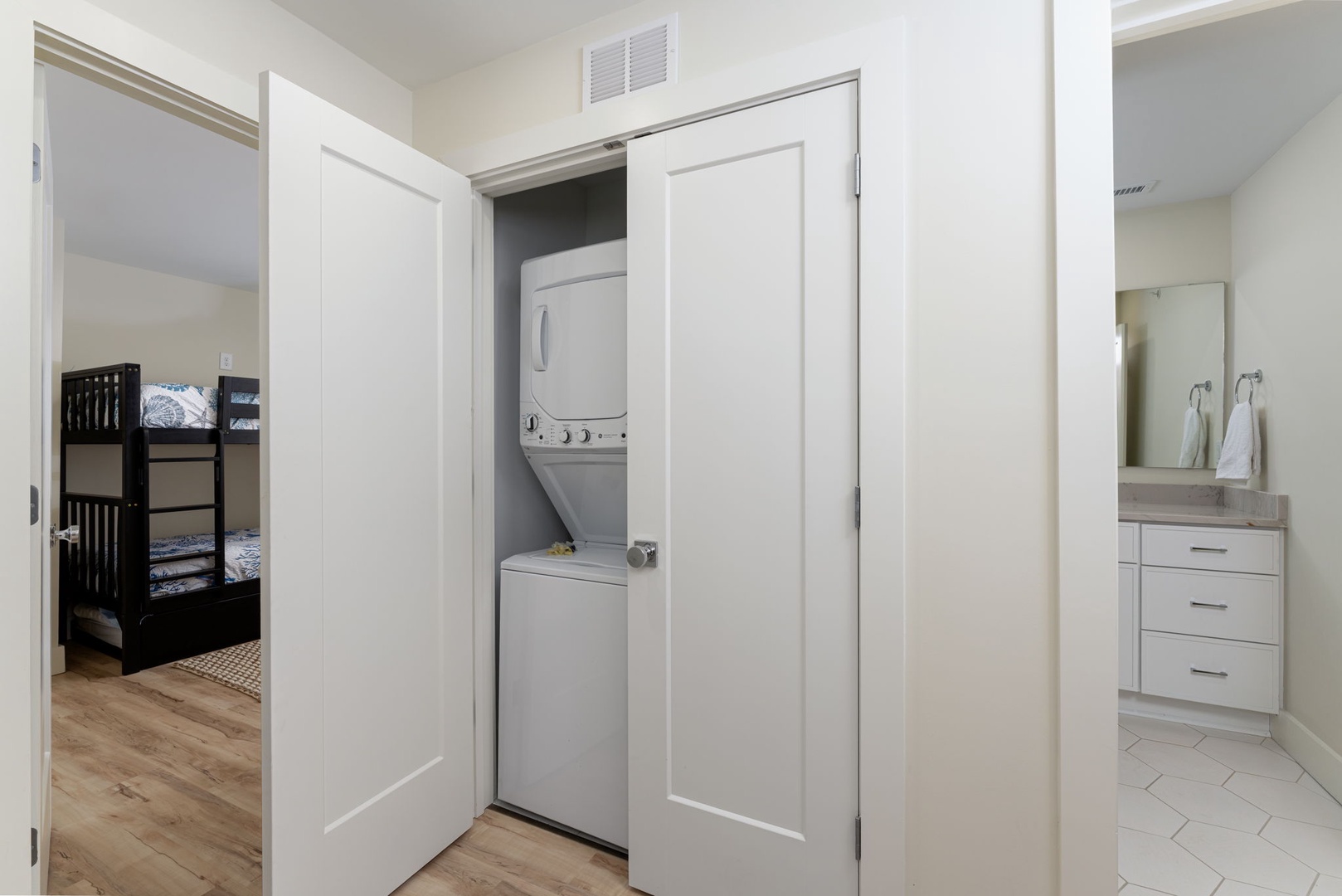 Your in-unit washer and dryer are conveniently tucked away in this hallway closet, keeping laundry simple and private during your stay.