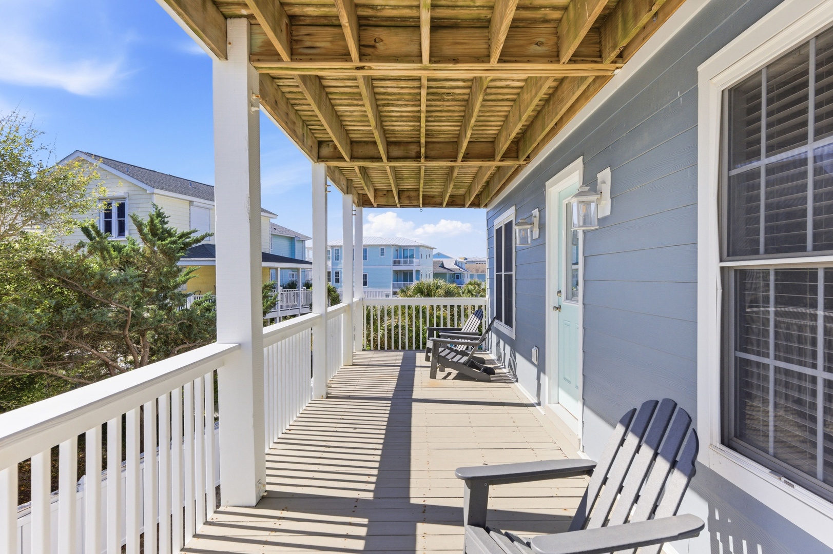 Picture yourself on your private covered deck with Adirondack chairs and a rocking chair, perfect for morning coffee or evening relaxation with neighborhood views.