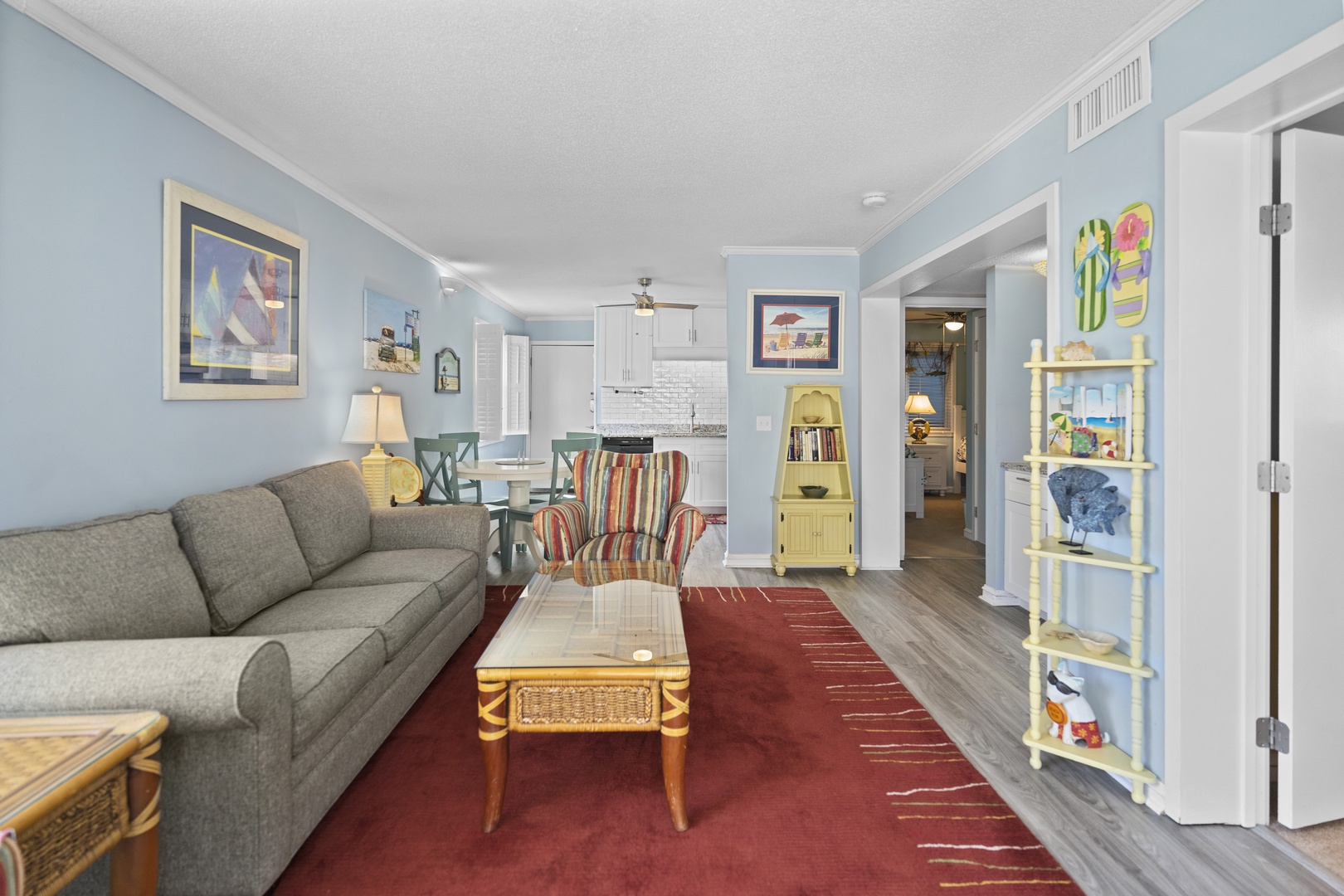 Relax in your bright, open living space with cozy sectional seating and charming coastal decor that makes you feel right at home.