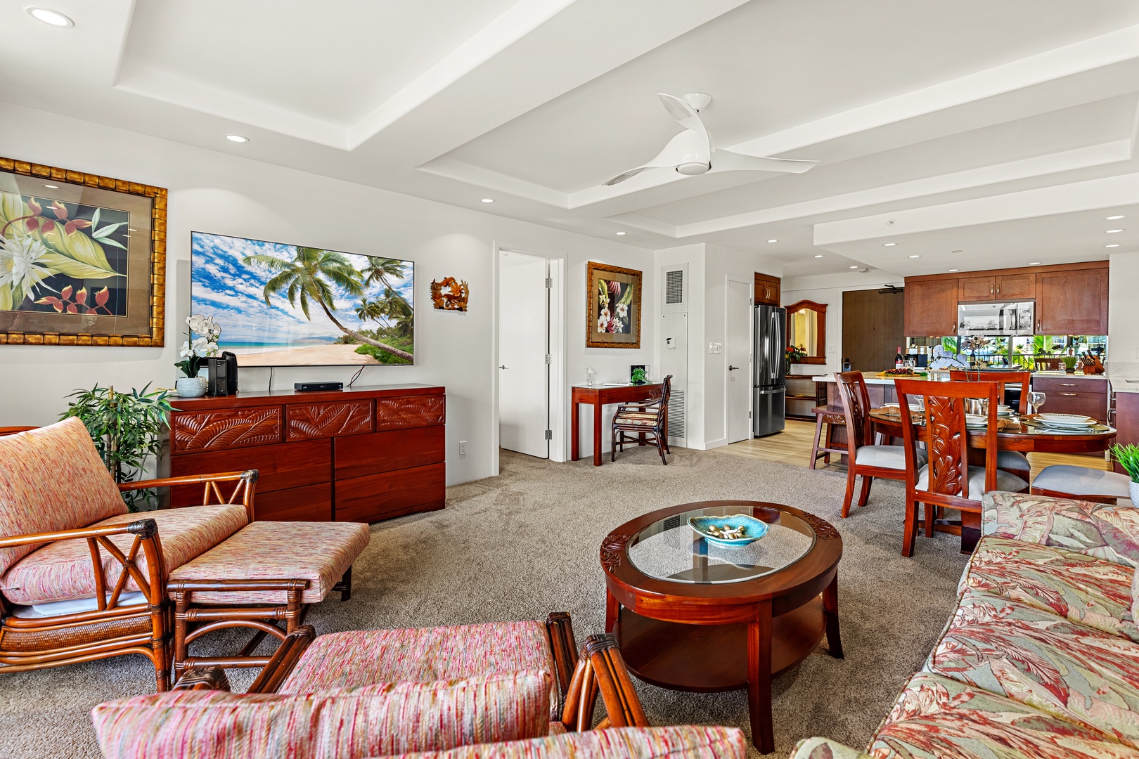 Unwind in a bright and welcoming living area, complete with a flat-screen TV and comfortable furnishings. Perfect for peaceful lounging.