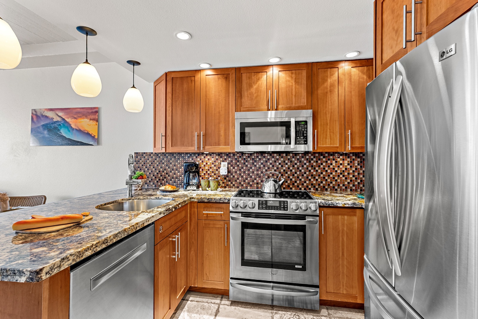 Cook together in this gourmet kitchen featuring gleaming granite counters, rich wood cabinetry, stainless steel appliances, and a stylish mosaic backsplash that adds warmth and character to your home away from home.