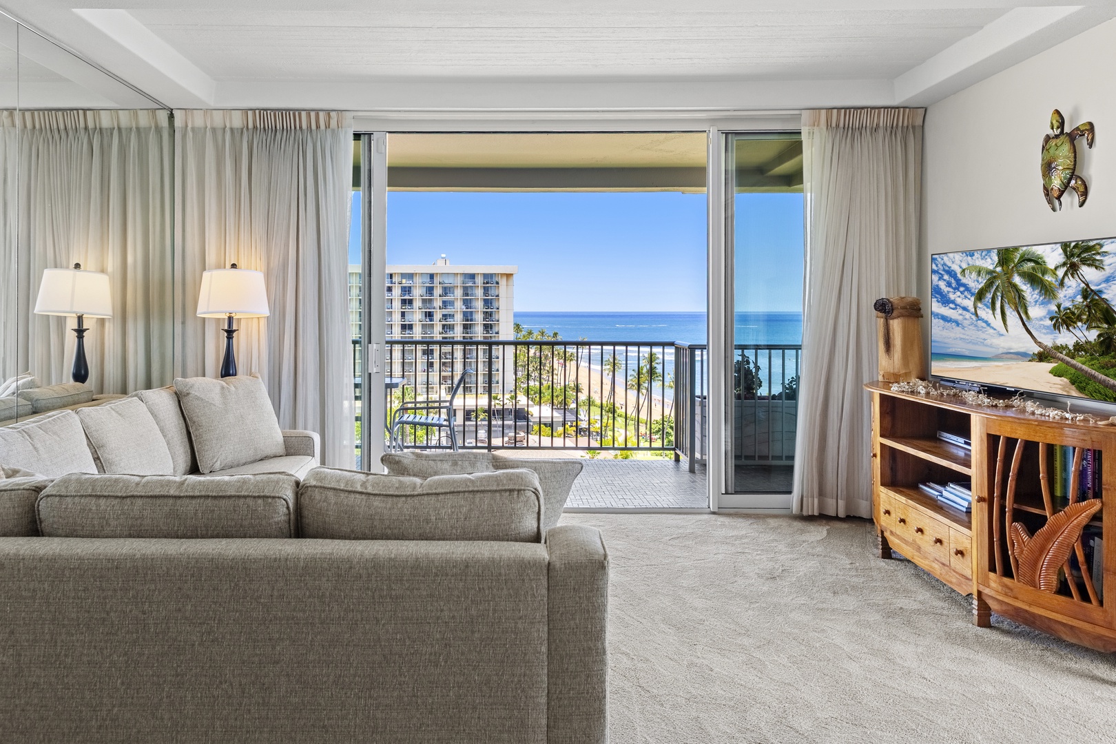 Unwind on plush seating while soaking in the stunning ocean views from your private balcony, where the soothing sounds of the sea create your perfect tropical escape.