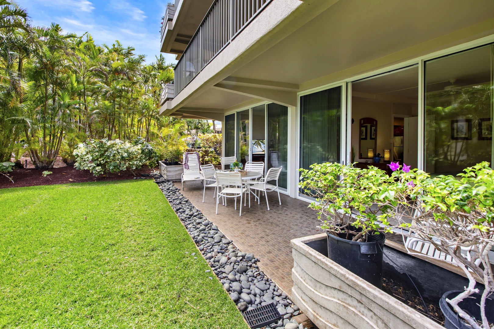 Step onto your private patio surrounded by tropical gardens and manicured lawns, perfect for morning coffee.