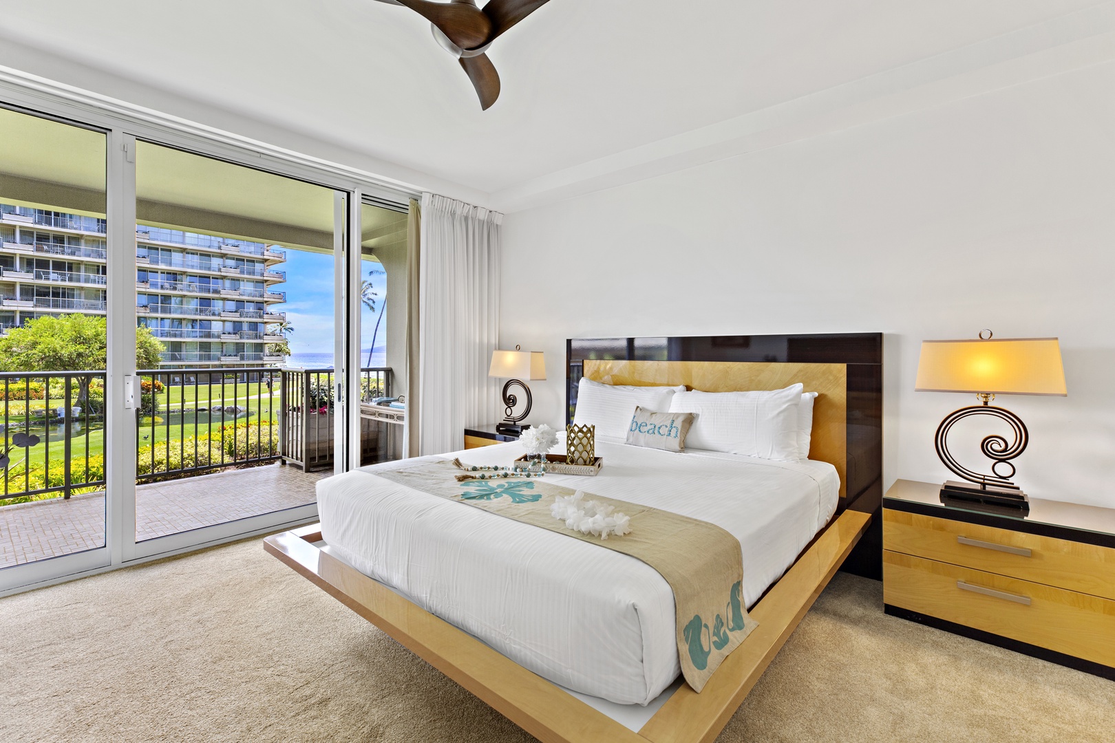 Wake up in your elegant bedroom with private balcony overlooking lush gardens. Feel the gentle breeze from the ceiling fan as you start your perfect vacation day.