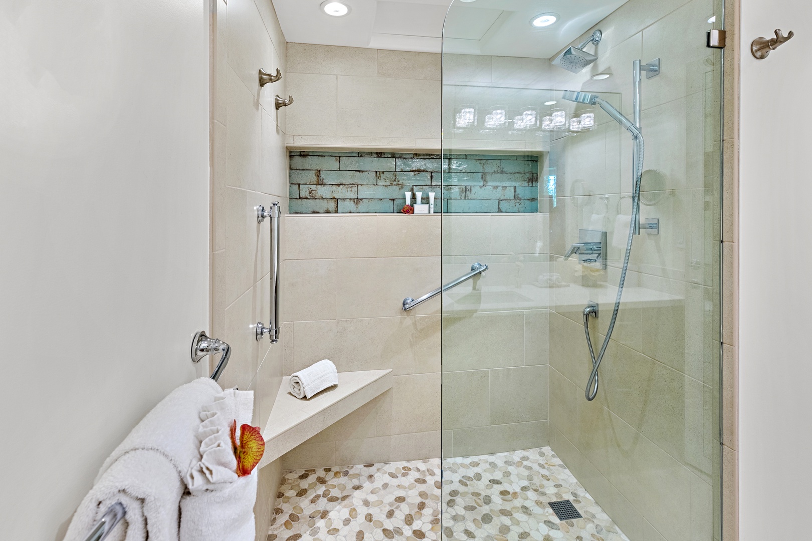 Step into a spacious master bathroom walk-in shower designed for a spa-like experience. Featuring sleek finishes and a refreshing, open design. Perfect for rinsing off after a day in the sun and sand.