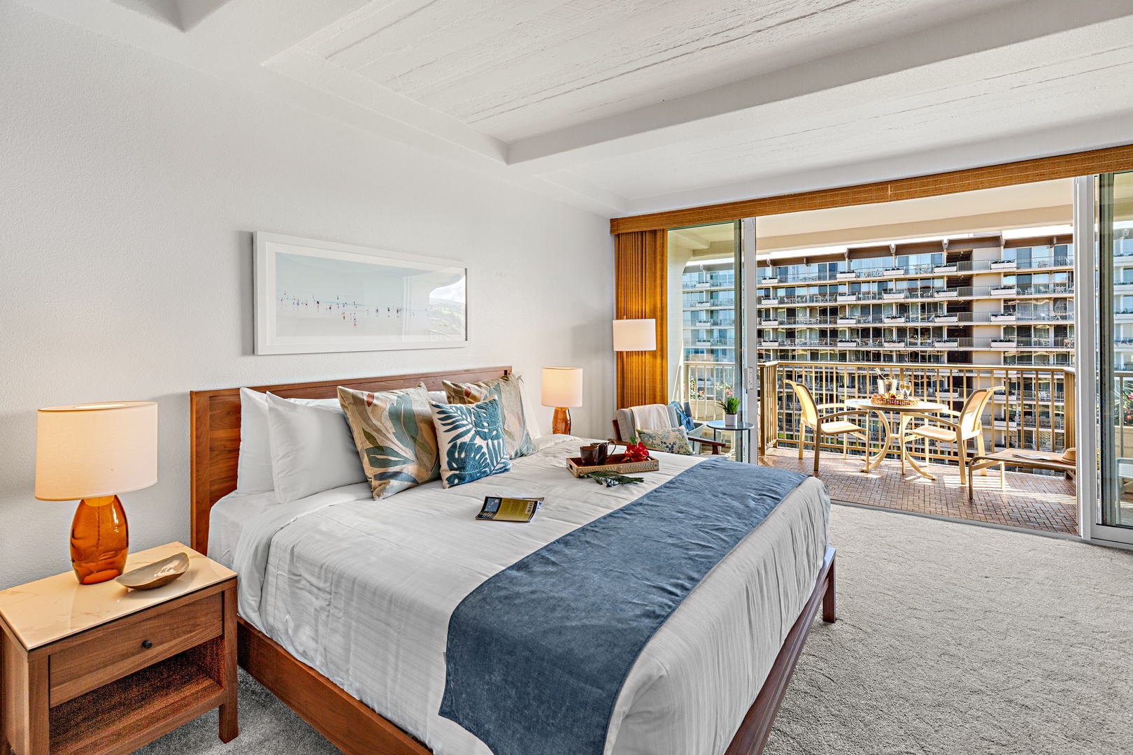 Sink into plush bedding with crisp linens and coastal-inspired accents, then step onto your private balcony to soak in the views and gentle breeze.
