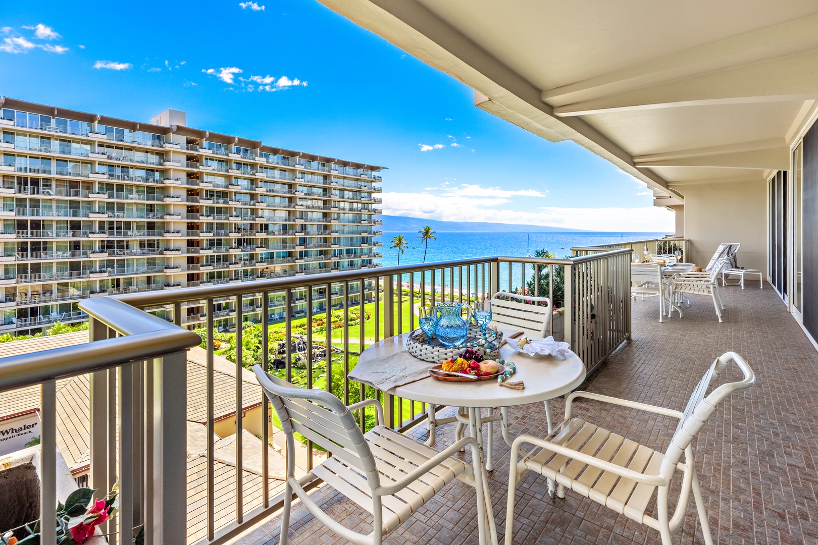 Sip your morning coffee on this spacious lanai, where the endless blue ocean stretches out before you and palm trees sway gently below. Perfect for unwinding with island breezes and stunning coastal views.