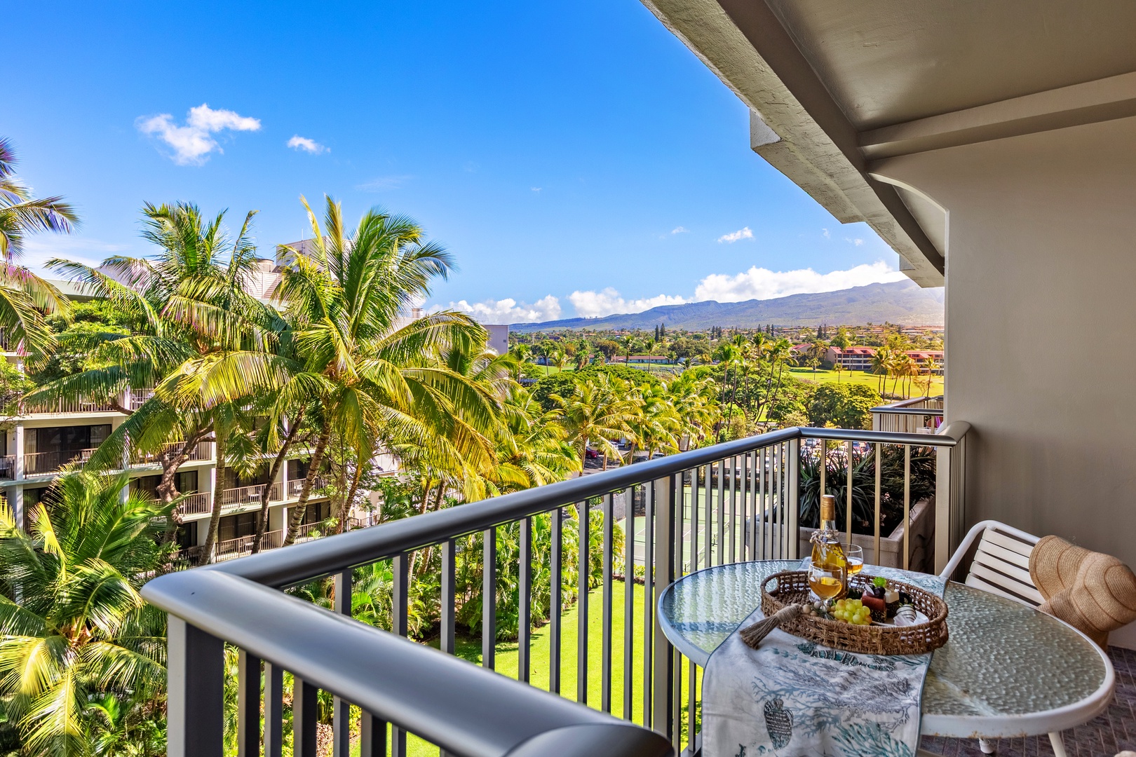 Serene Mountain views right from your private balcony. Unwind in comfortable outdoor seating as the island’s lush peaks and golden skies create the perfect peaceful escape.