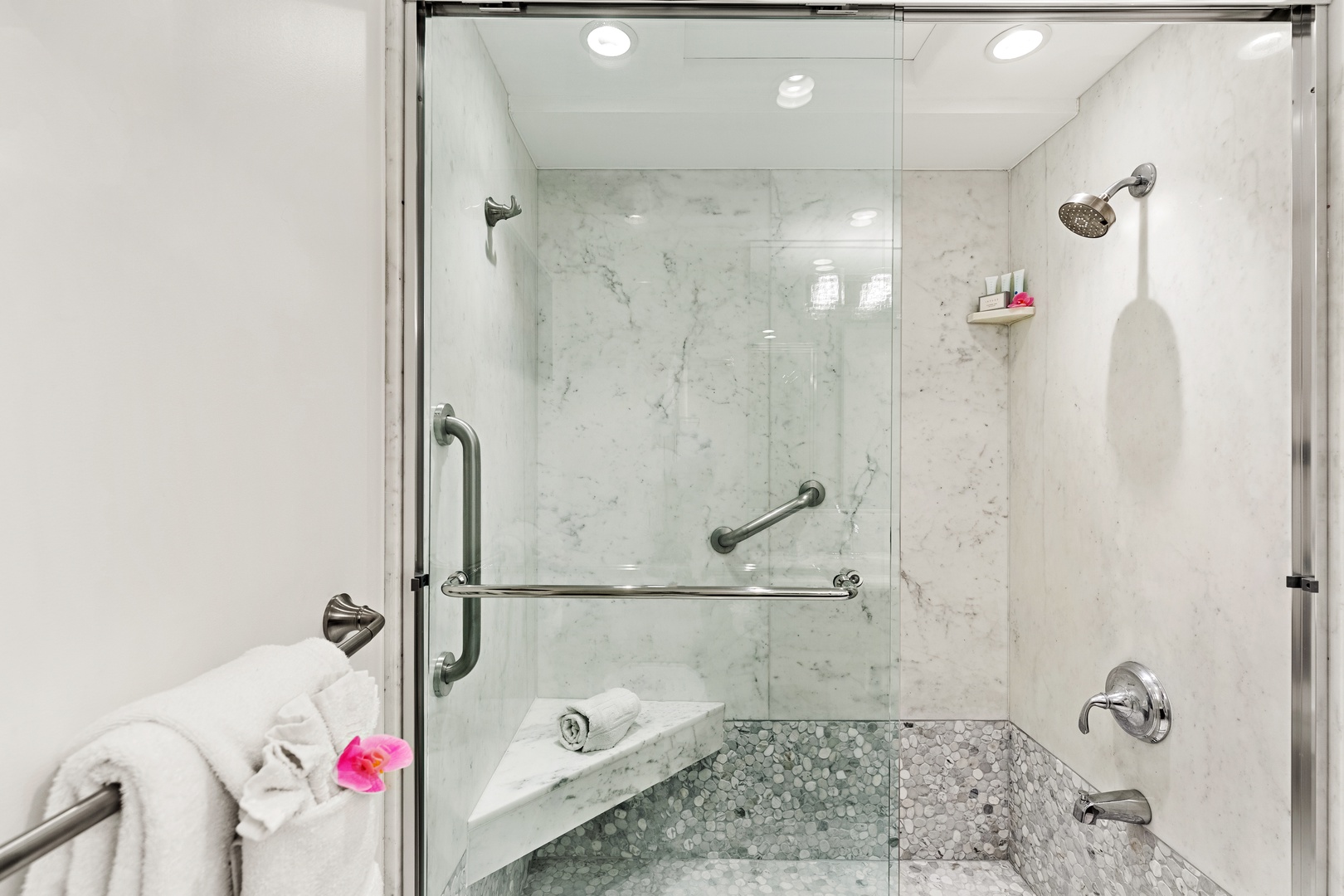 Step into a spacious walk-in shower designed for a spa-like experience. Featuring sleek finishes and a refreshing, open design. Perfect for rinsing off after a day in the sun and sand.