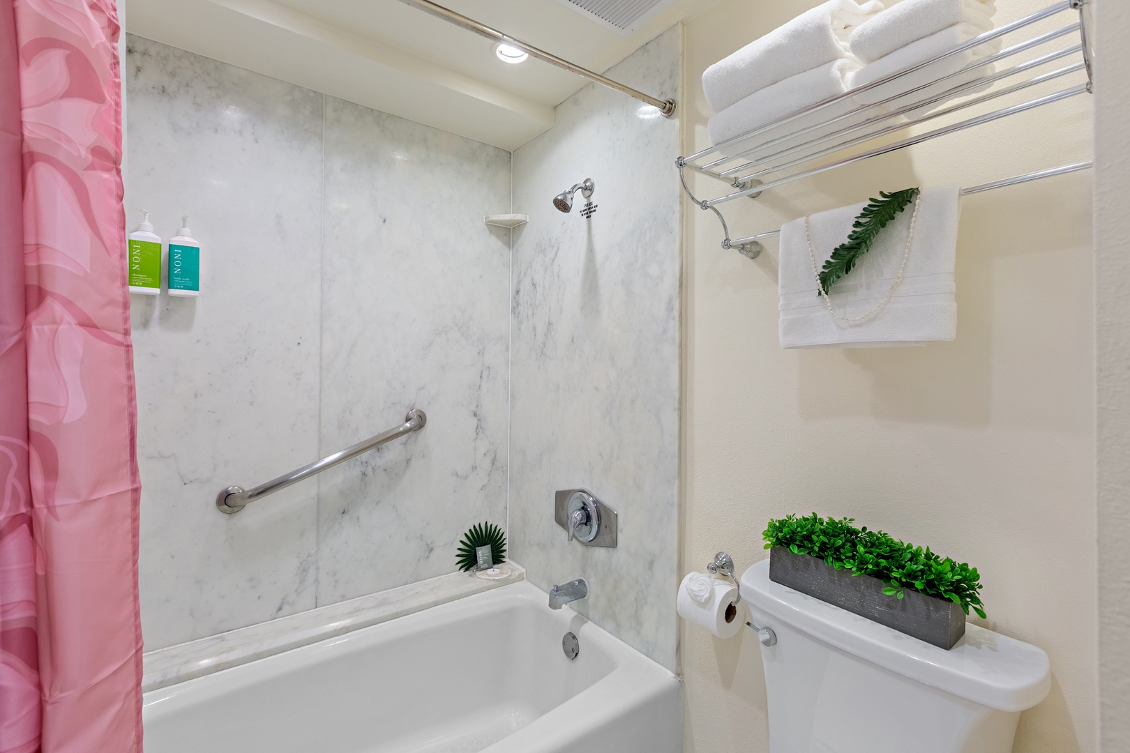 Elevated comfort and thoughtful design. A beautifully appointed bathroom featuring a spacious vanity and refined finishes that bring a touch of island luxury to your everyday routine.