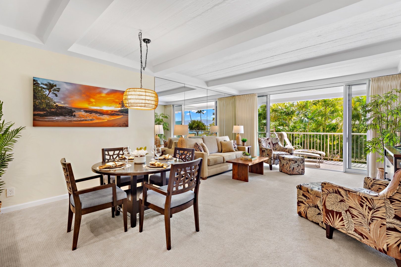 Bright and inviting open-concept kitchen featuring warm wood cabinetry, sleek granite countertops, and a spacious island that flows seamlessly into the living and dining areas. Perfect for entertaining or relaxing in comfort.