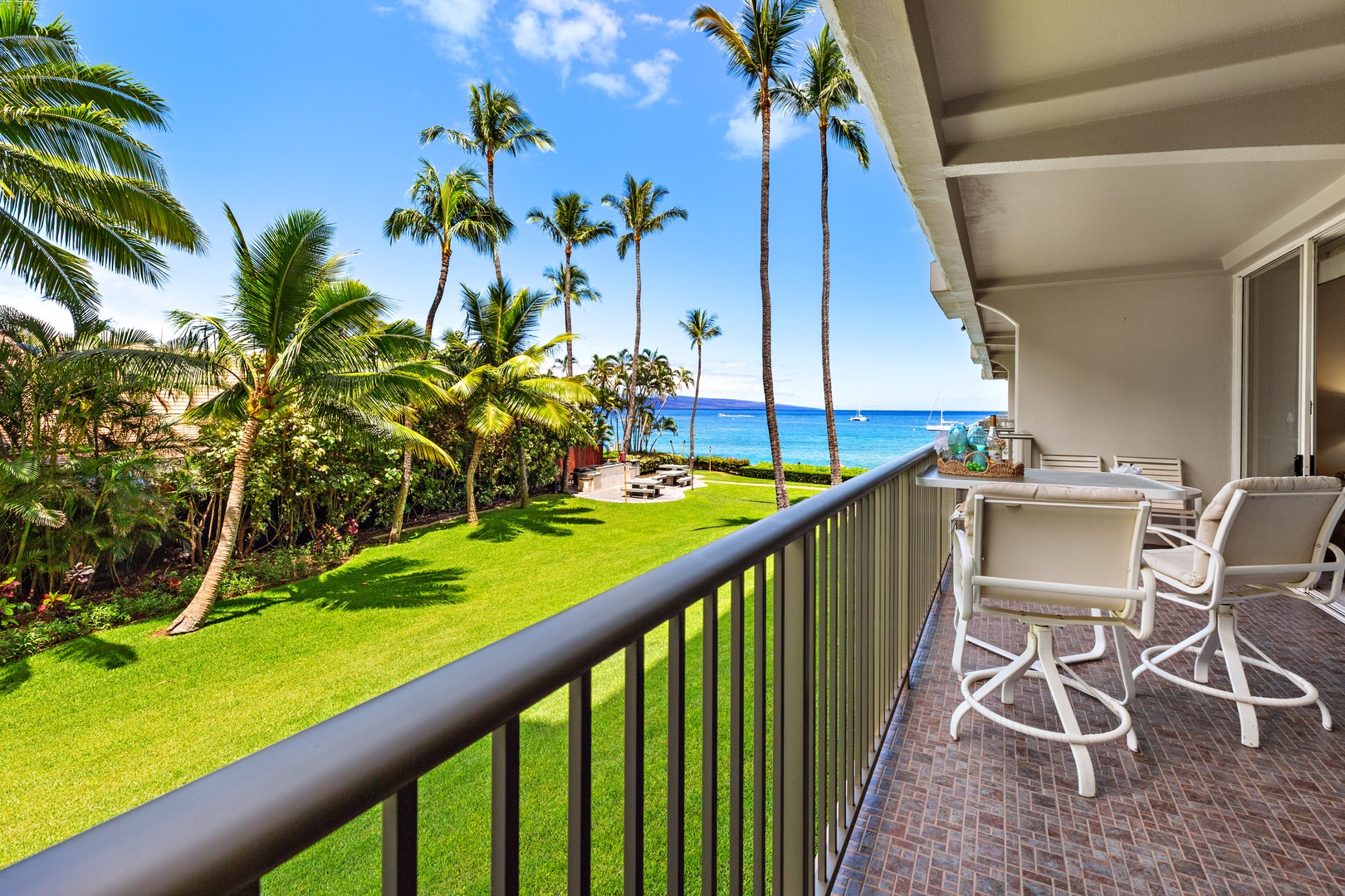 Imagine sipping your morning coffee on your private balcony, gazing over lush tropical gardens and swaying palms to the sparkling blue ocean beyond—pure paradise.