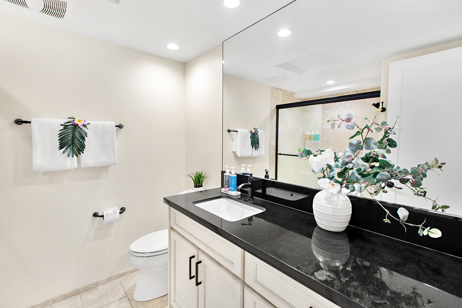 Step into your pristine private bathroom with sleek countertops, fresh linens, and elegant touches—your personal sanctuary for unwinding after a day of adventure.