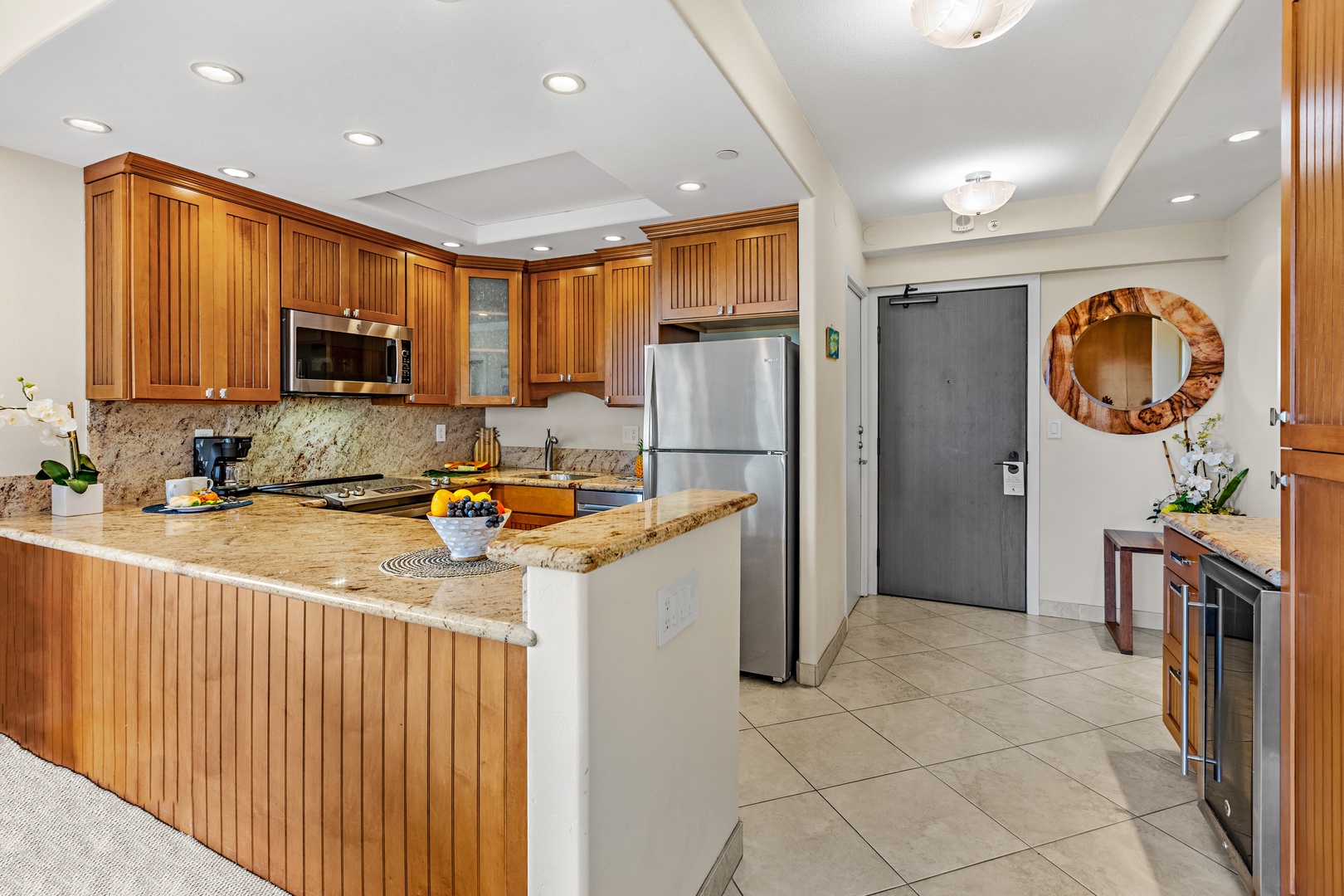 Your gourmet kitchen features granite countertops, premium appliances, and warm wood cabinetry perfect for preparing memorable meals together.