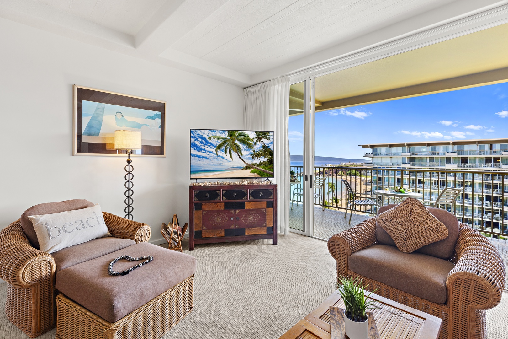 Sink into comfortable wicker seating while your ocean view frames perfect blue horizons. The sliding door invites fresh breezes to flow through your living space.