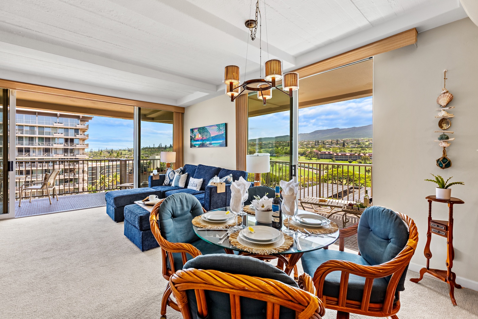 Relax in your stylish living space with stunning panoramic views through floor-to-ceiling windows and elegant furnishings.