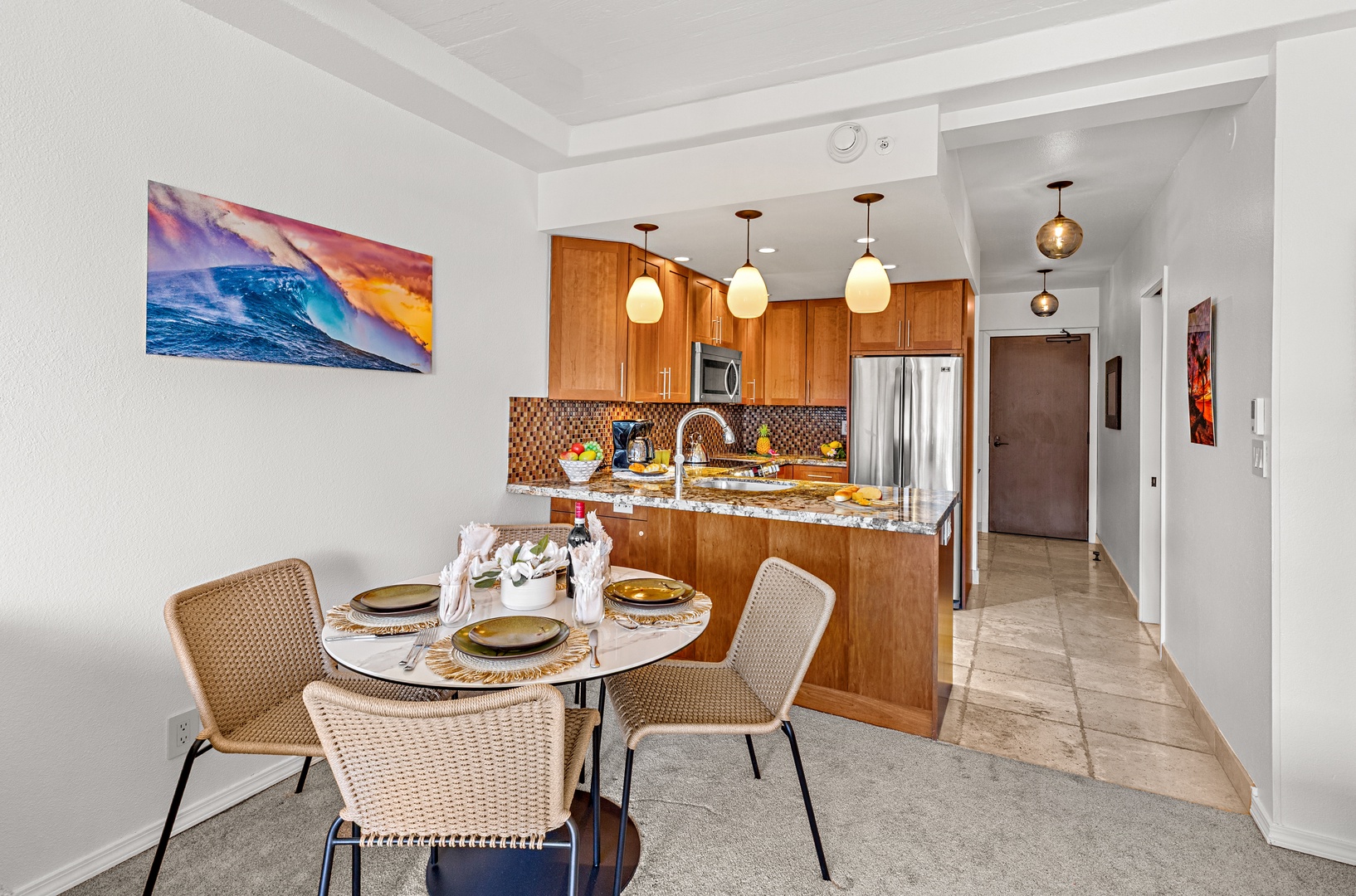 Gather at your own dining table, just steps from a fully-equipped kitchen with granite counters, stainless appliances, and warm wood cabinetry—everything you need to whip up breakfast or a sunset feast.