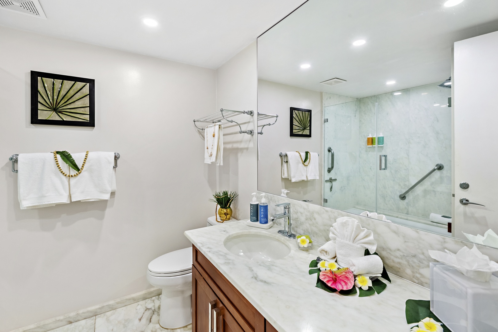 Elevated comfort and thoughtful design. A beautifully appointed guest bathroom featuring a spacious vanity and refined finishes that bring a touch of island luxury to your everyday routine.
