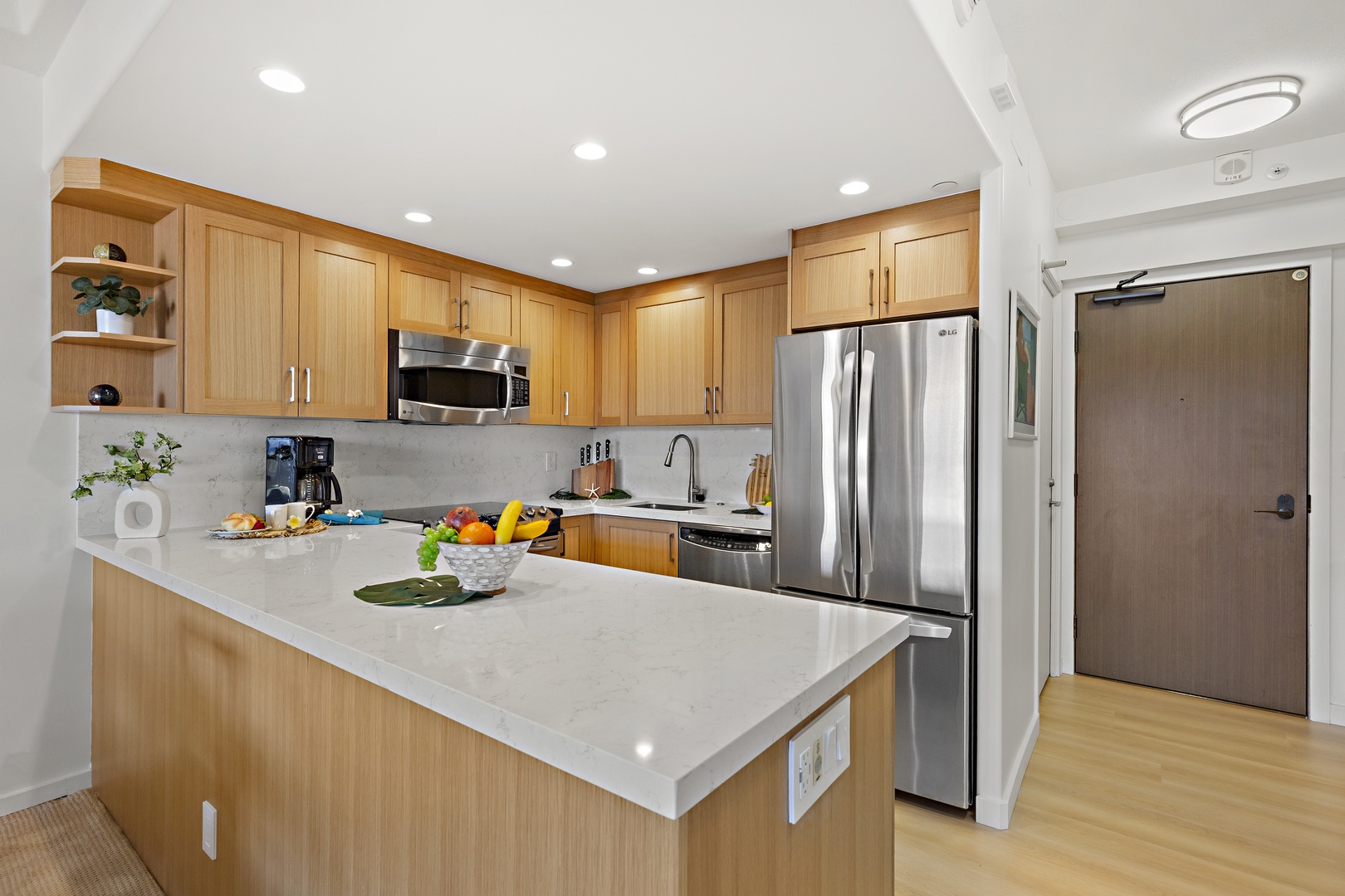 Step into your bright, modern kitchen with sleek quartz counters, light wood cabinetry, and stainless steel appliances—everything you need to prepare meals and gather with loved ones.
