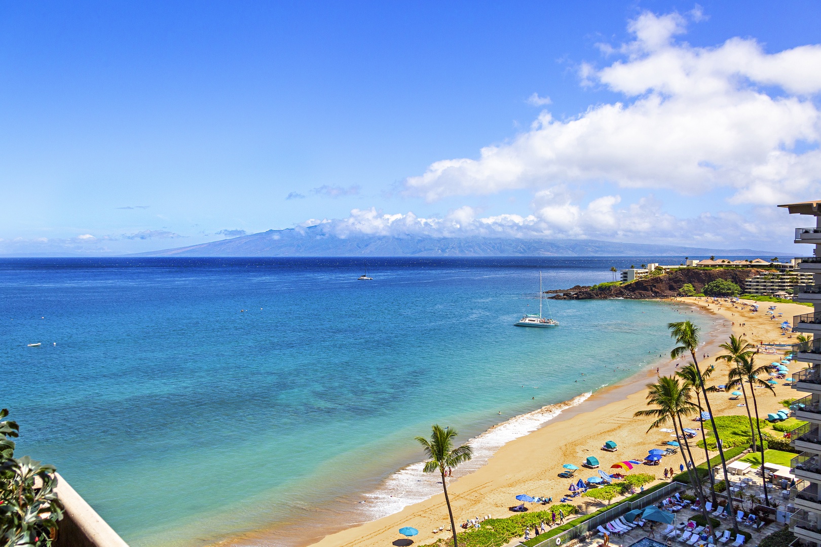 Stunning beachfront location with sweeping ocean vistas, swaying palms, and golden sands just steps from the resort—an idyllic Hawaiian escape awaits.