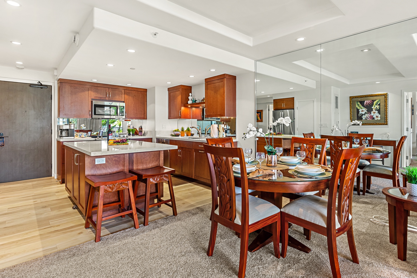An inviting dining space where island elegance meets breathtaking ocean views. Gather around the beautifully set table, surrounded by warm textures, coastal-inspired décor, and soft ambient lighting.