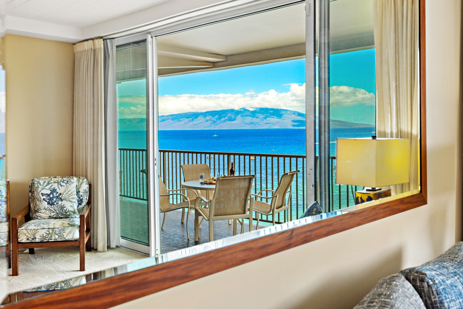 Your private balcony frames stunning ocean and mountain views—enjoy morning coffee or sunset cocktails while the island breeze drifts through your open doors.