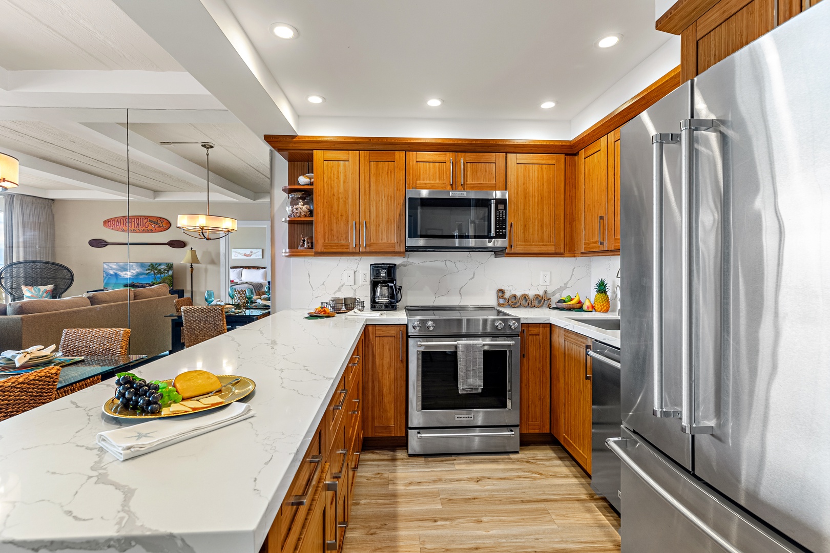 Your gourmet kitchen awaits with marble countertops, stainless steel appliances, and warm wood cabinetry—perfect for creating memorable meals together.