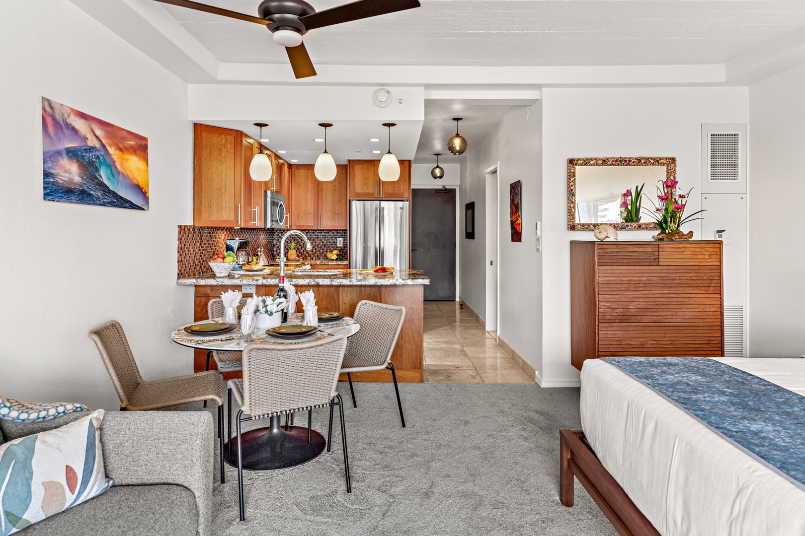 Imagine yourself in this stylish, open-concept space where elegant dining meets cozy relaxation. Enjoy meals at your private table, unwind on the plush sofa, and cook effortlessly in your fully equipped kitchen.