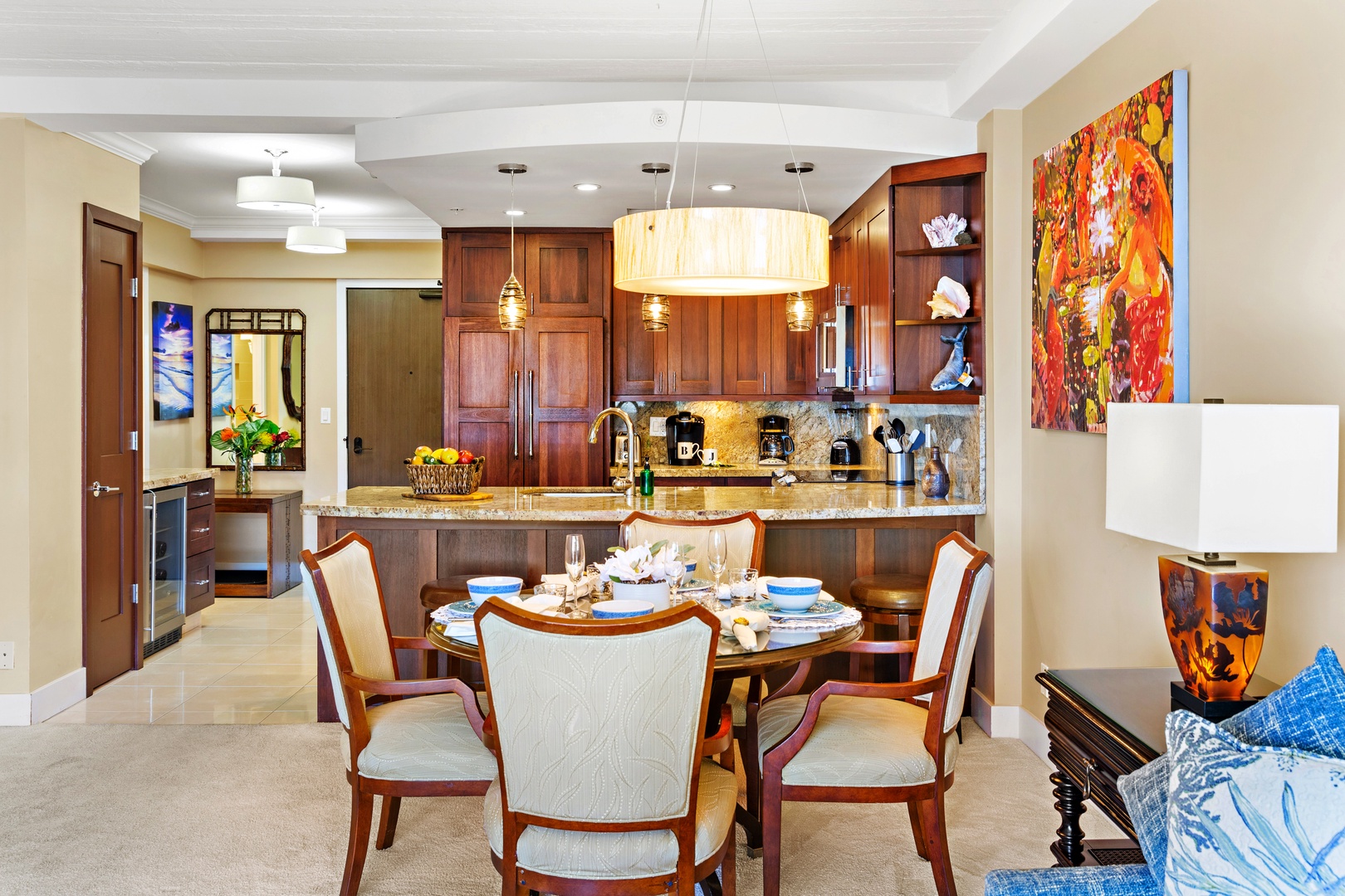 Step into your open-plan dining and kitchen space, where rich wood cabinetry and polished granite countertops set the stage for memorable meals together around the elegant dining table.