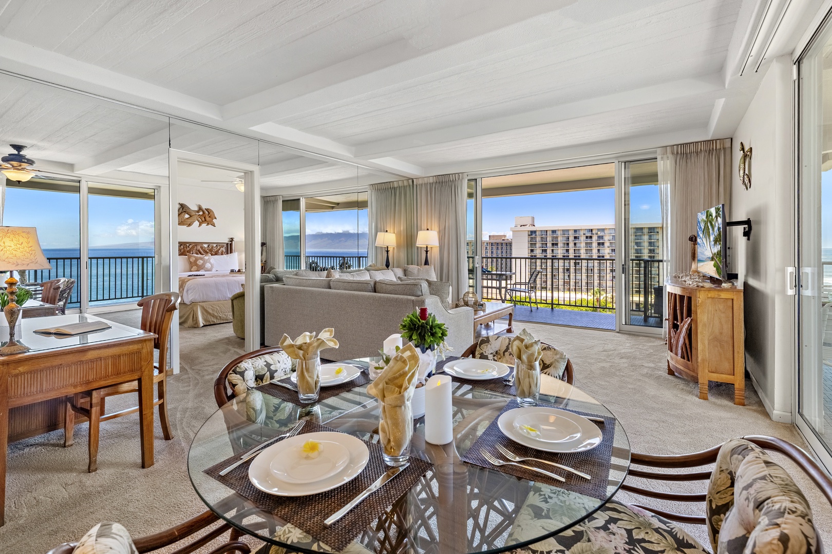 Picture yourself relaxing in this stunning open-concept space, where ocean breezes and sunlight fill every corner. Gather with loved ones around the elegant dining table, unwind on the plush sofa, and enjoy seamless access to your private balcony overlook