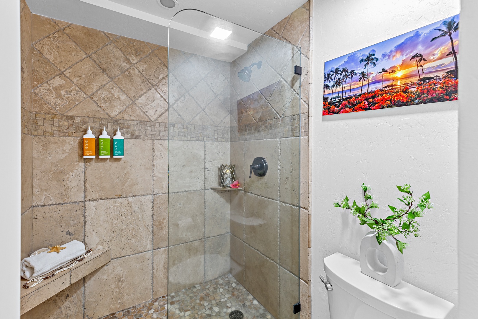 Step into a spacious walk-in shower designed for a spa-like experience. Featuring sleek finishes and a refreshing, open design. Perfect for rinsing off after a day in the sun and sand.