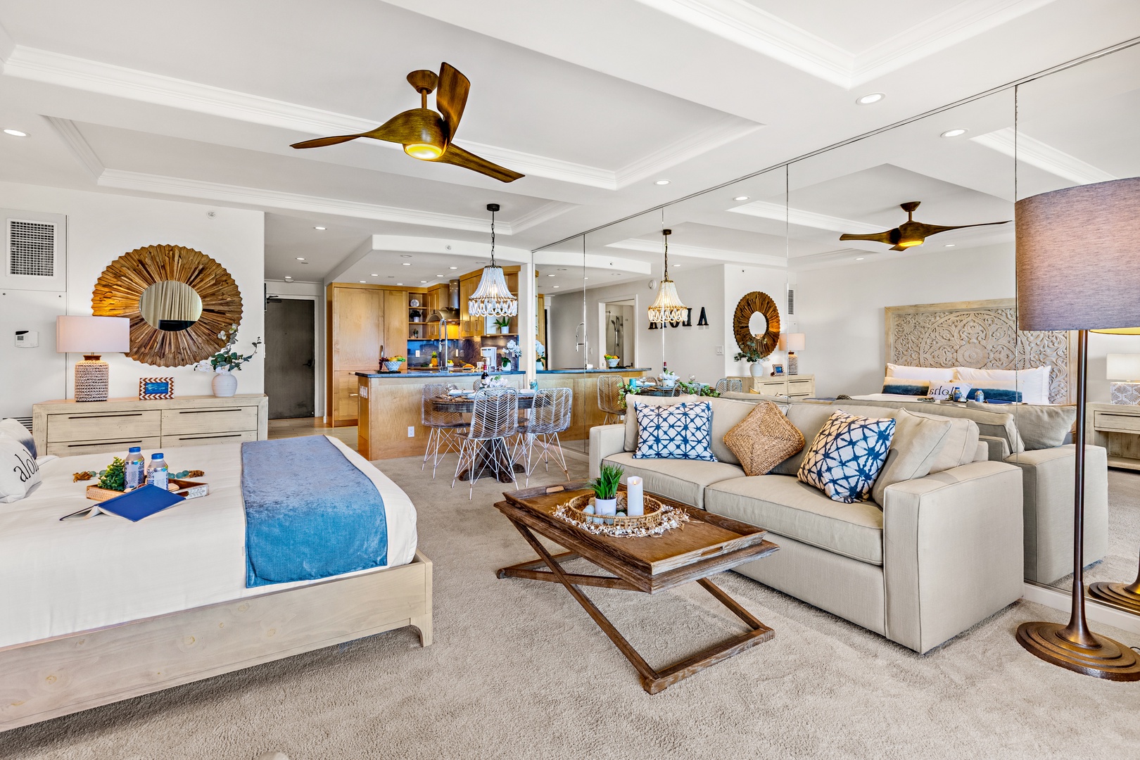 Relax in your bright, open-concept retreat where coastal charm meets modern comfort. Sink into plush seating, enjoy breezy ceiling fans overhead, and let the soothing blue accents inspire easy island living.