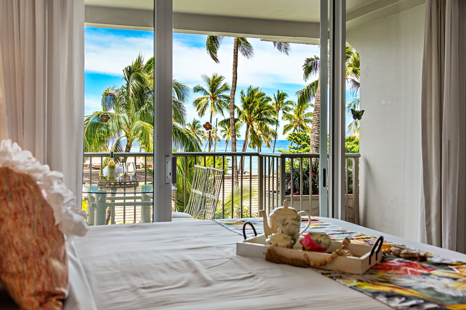 This bright, airy bedroom features a plush king-size bed for ultimate comfort, with direct access to a private balcony that blends indoor-outdoor island living in the heart of paradise