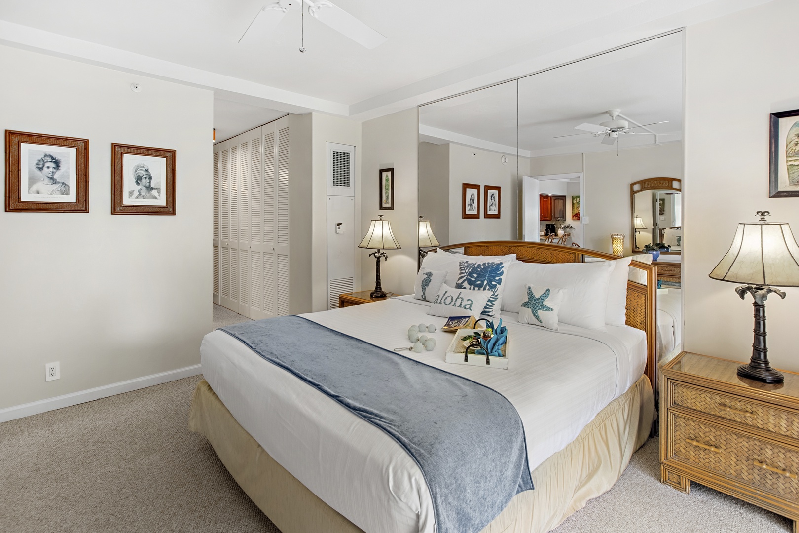 Sink into crisp white linens and coastal charm in your serene bedroom retreat, complete with thoughtful amenities and tropical touches.