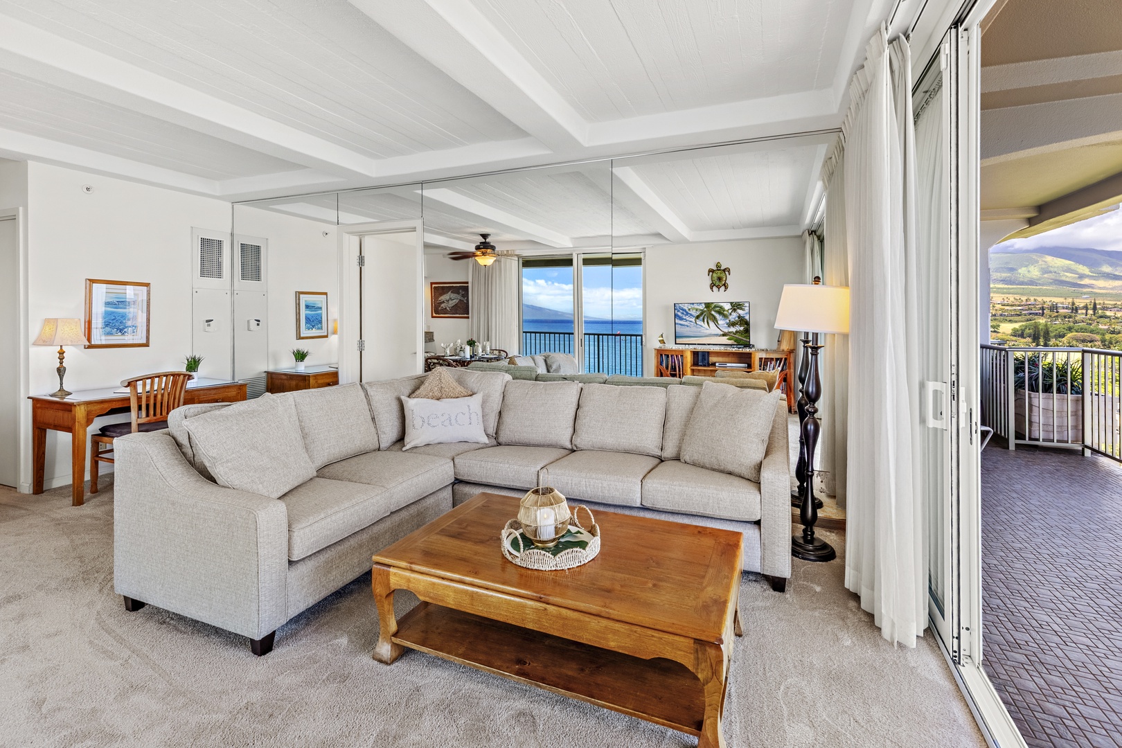 Sink into your cozy sectional sofa and take in stunning ocean views through the wall of windows. Your private balcony offers even more breathtaking scenery to enjoy each morning.