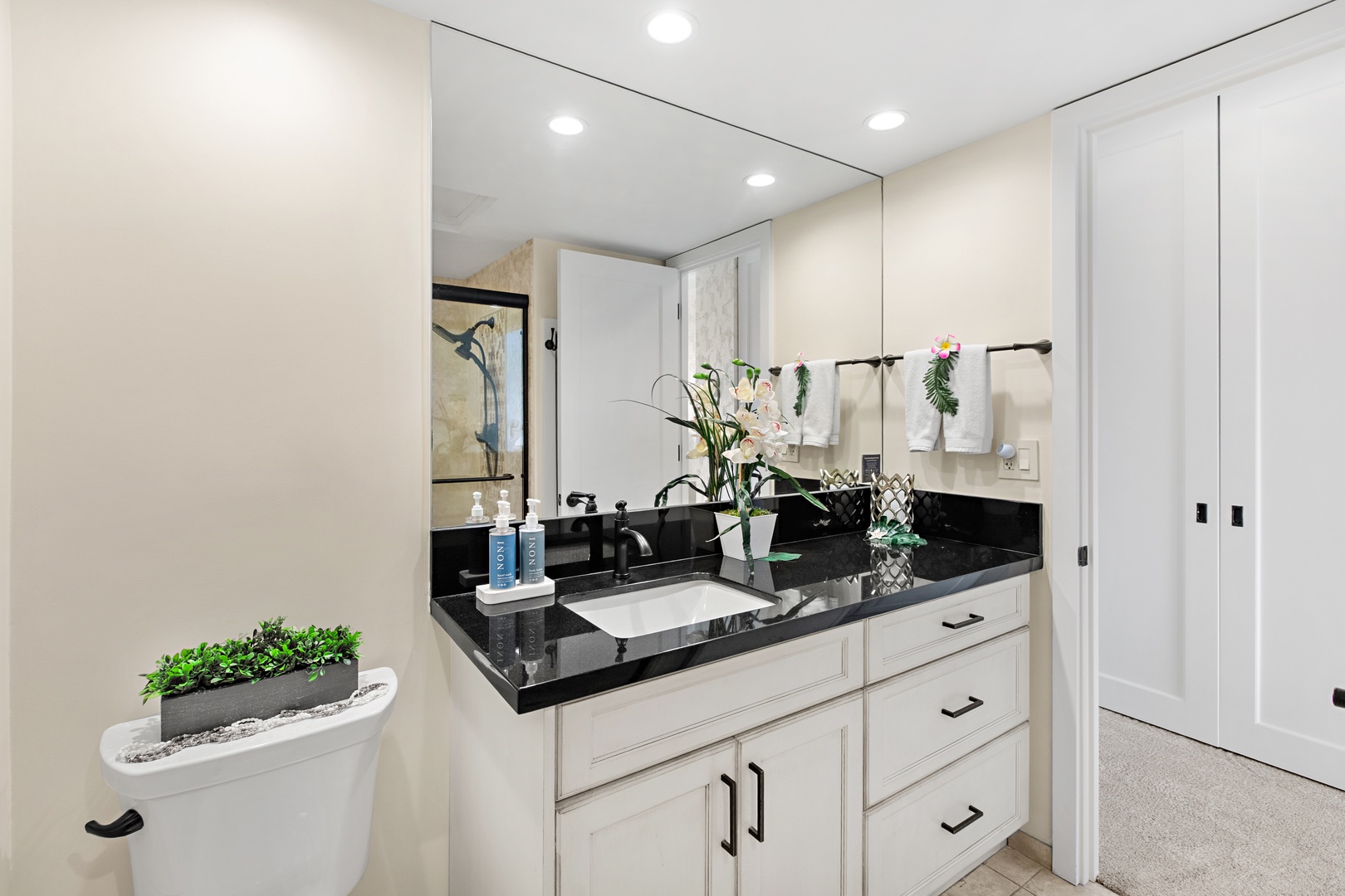 Freshen up in your bright, modern bathroom with sleek granite counters and a spacious glass-enclosed shower—your private sanctuary to start and end each day.