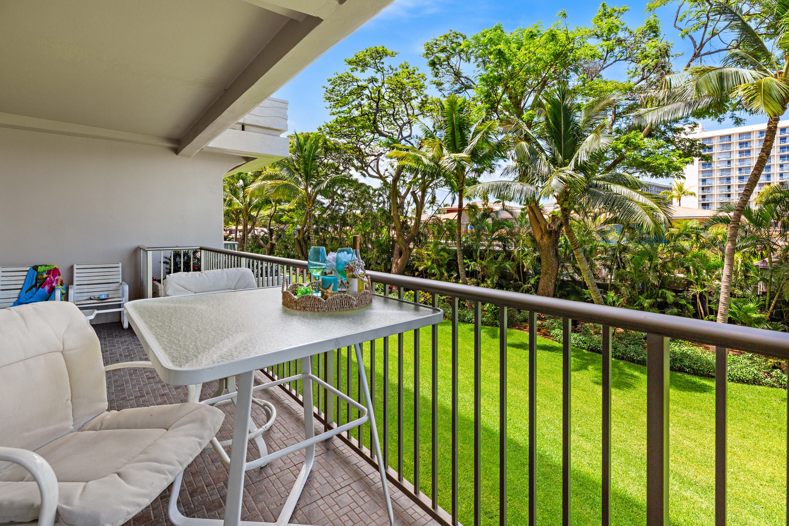 Sip your morning coffee on your private balcony overlooking lush tropical gardens and swaying palms—a peaceful escape where every moment feels like a vacation.