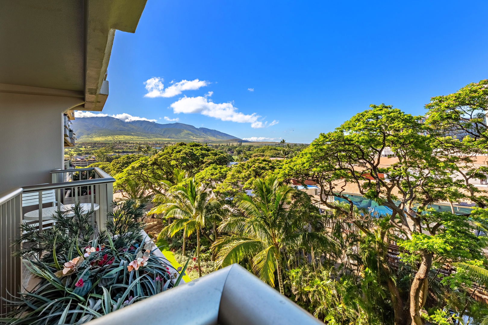 Balcony offers stunning mountain and tropical garden views—perfect for your morning coffee while soaking in the serene Hawaiian landscape and lush greenery.