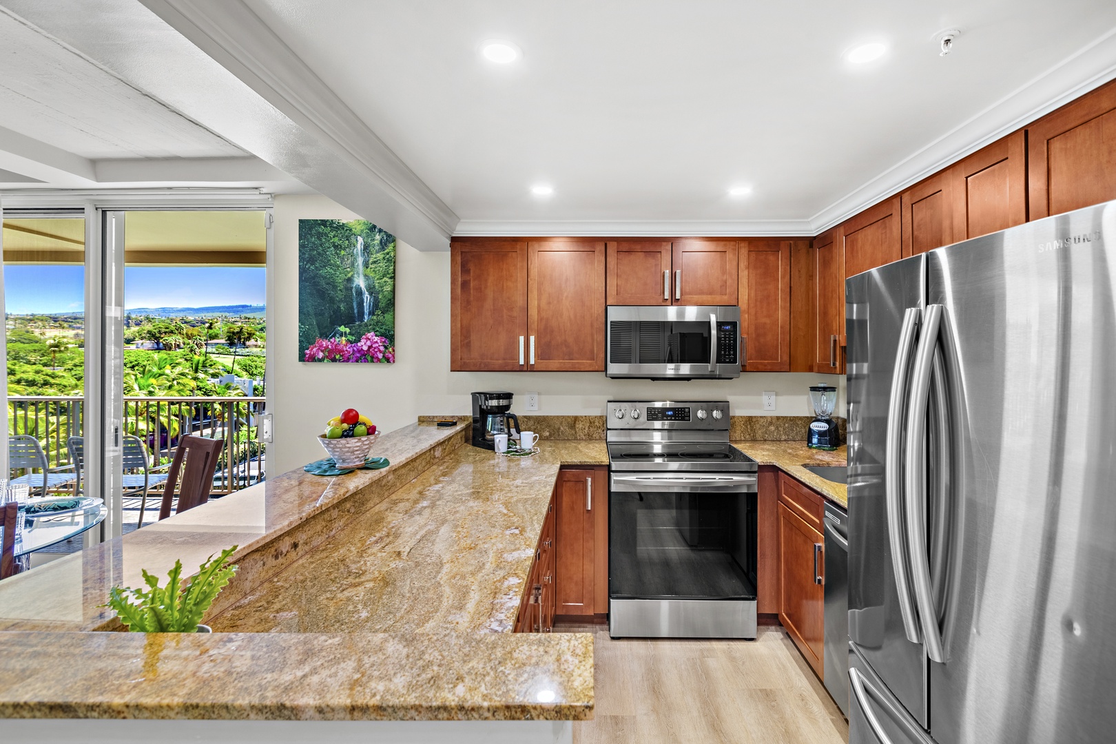 Thoughtfully designed for relaxed resort living, this bright and modern kitchen features sleek quartz countertops, stainless steel appliances, and a clean coastal aesthetic—perfect for preparing everything from fresh island breakfasts to sunset refreshmen