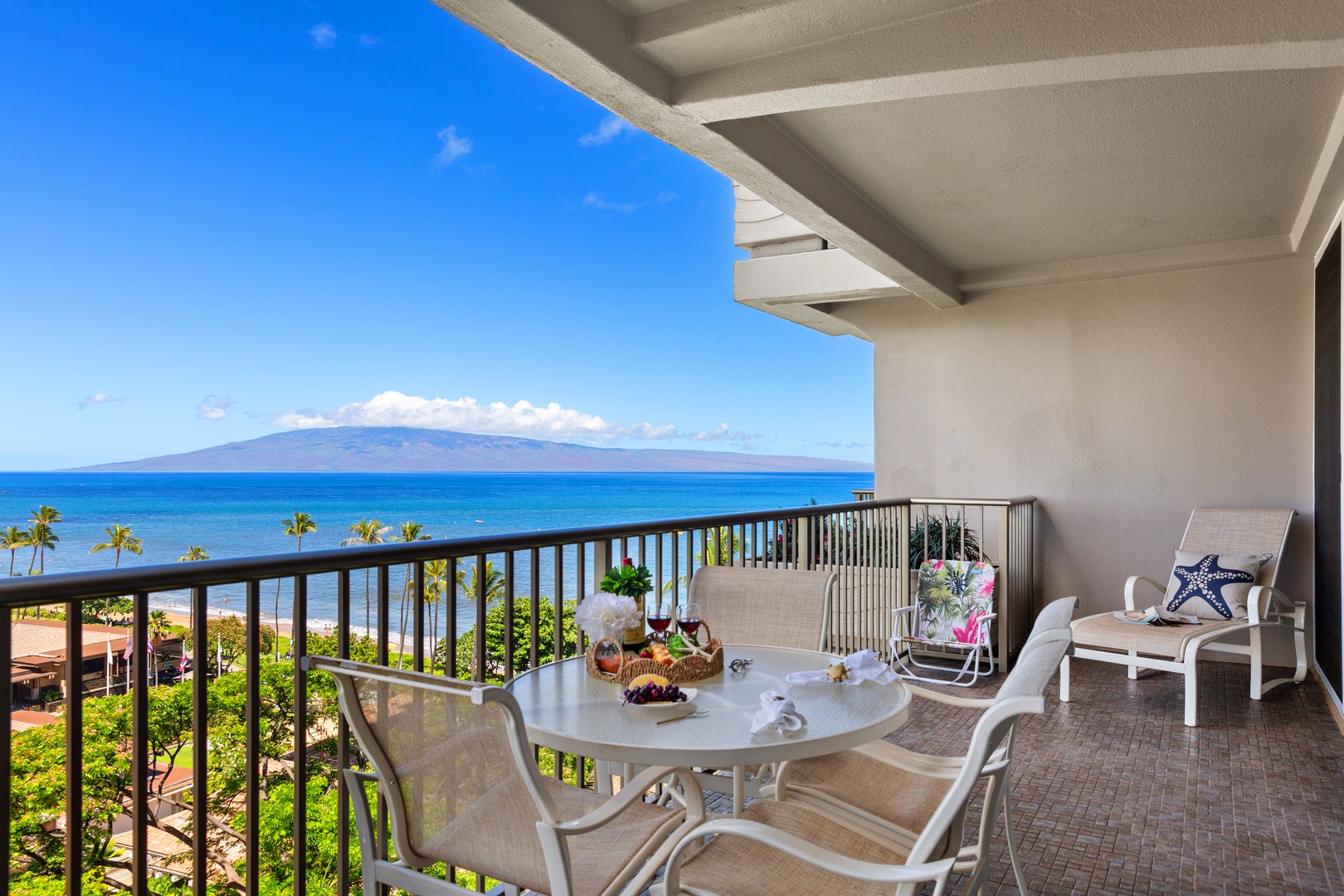 Expansive oceanfront balcony with stunning island views, perfect for your morning coffee or sunset cocktails. Comfortable seating lets you soak in the tropical breeze and endless blue horizon.