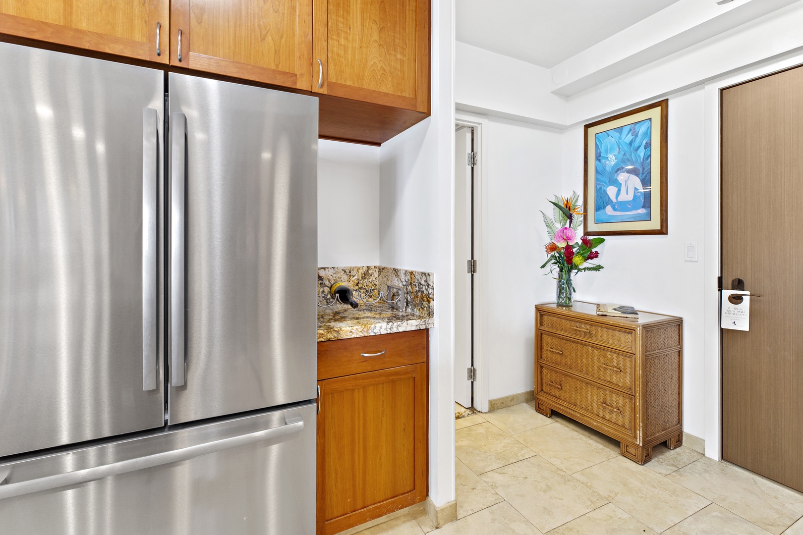 Your fully equipped kitchen features stainless steel appliances and granite countertops, with fresh flowers greeting you upon arrival.