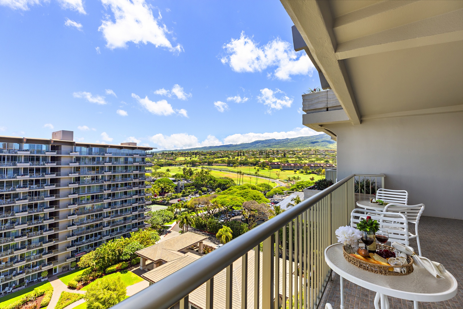 Sweeping views of lush golf greens and distant mountains stretch out from your private balcony—perfect for morning coffee or evening relaxation in this peaceful setting.