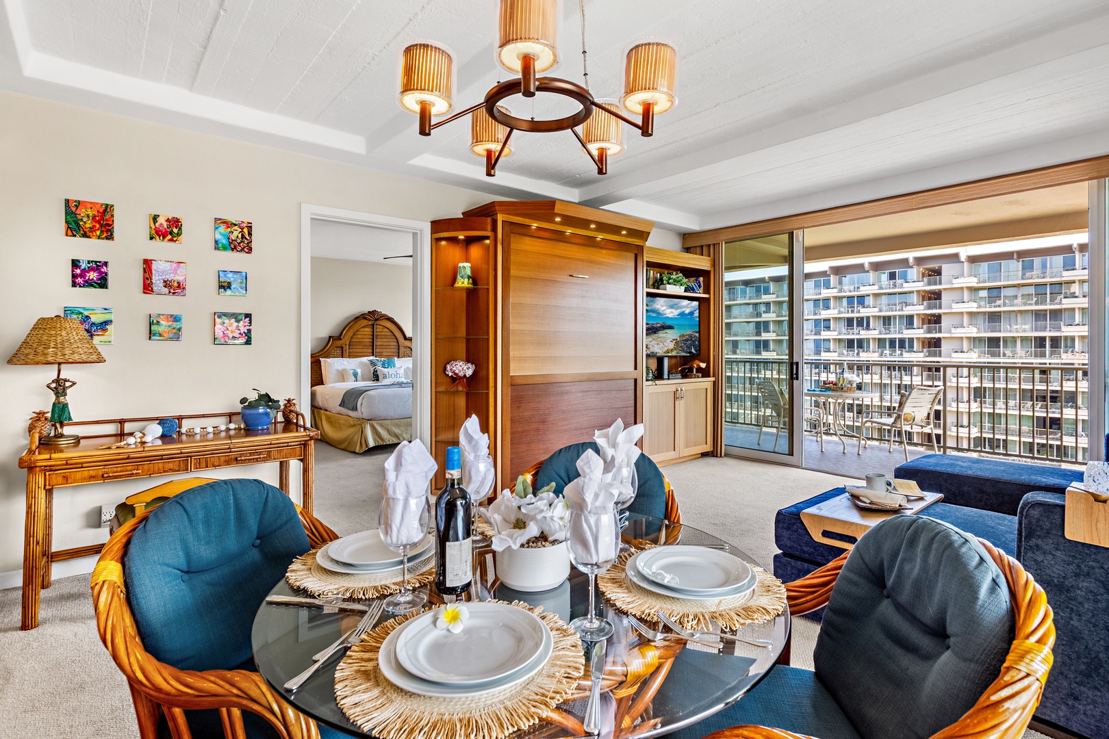 Your stylish suite combines elegant dining with a cozy living area and Murphy bed, overlooking the vibrant cityscape from your private balcony.