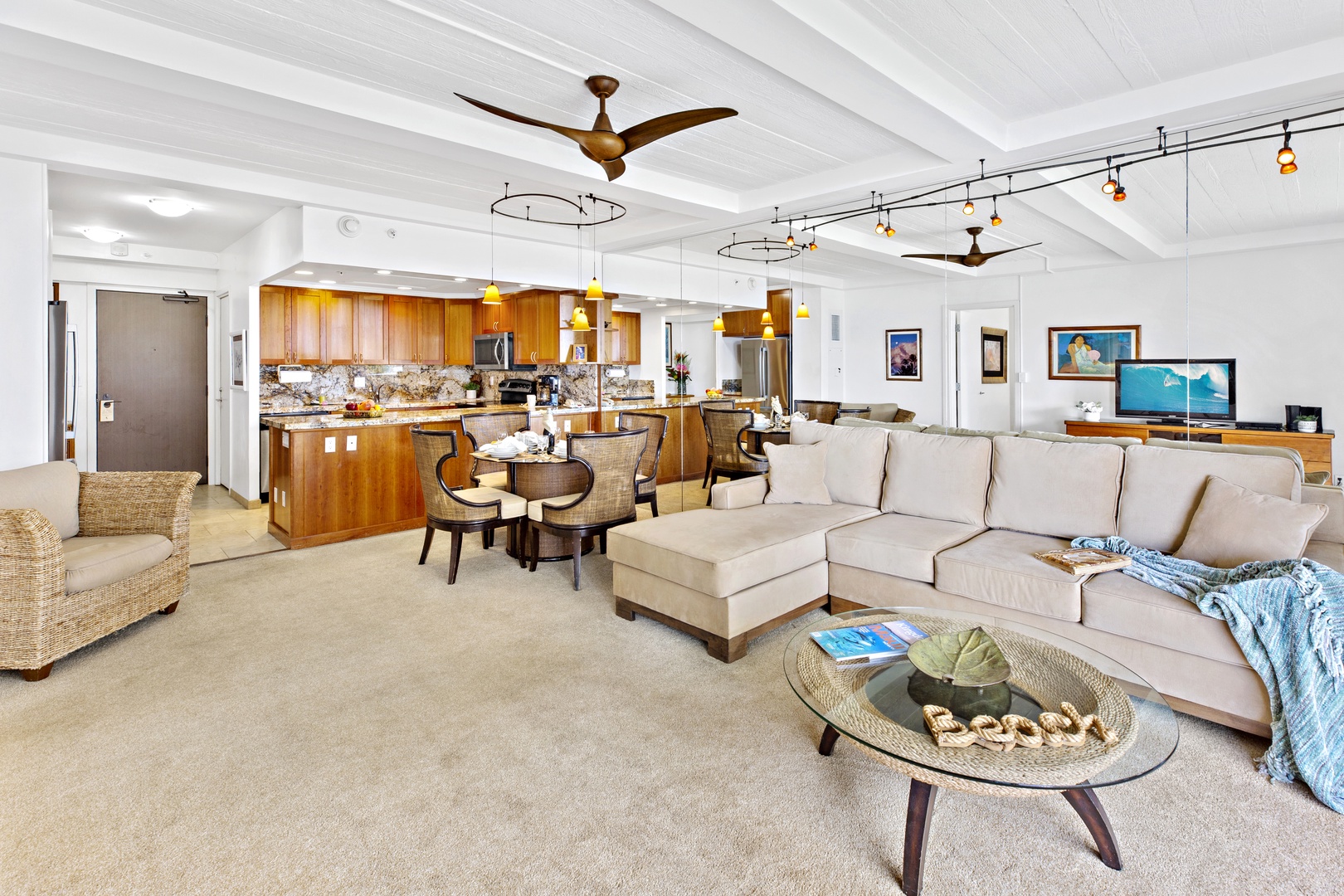 Relax in your spacious living area with plush seating, enjoy meals at the dining table, and create culinary masterpieces in the fully-equipped kitchen.